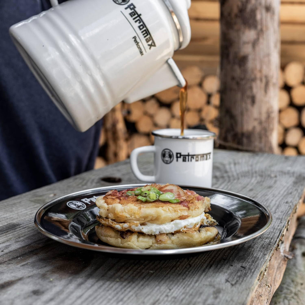 Petromax enamelware plate serving hot food straight from the grill
