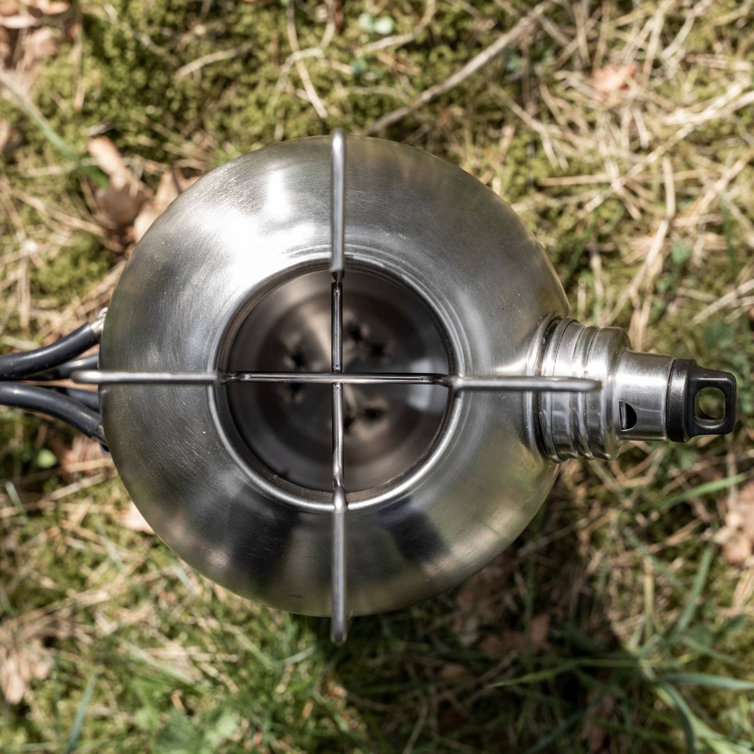 Petromax Fire Kettle fueled by twigs for outdoor cooking