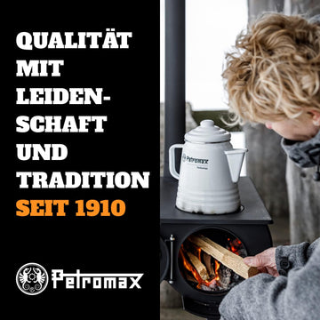 Petromax percolator on barbecue grill for smoky outdoor brews.