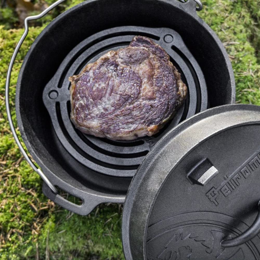 Petromax Stack Grate over campfire acting as a cooking surface.