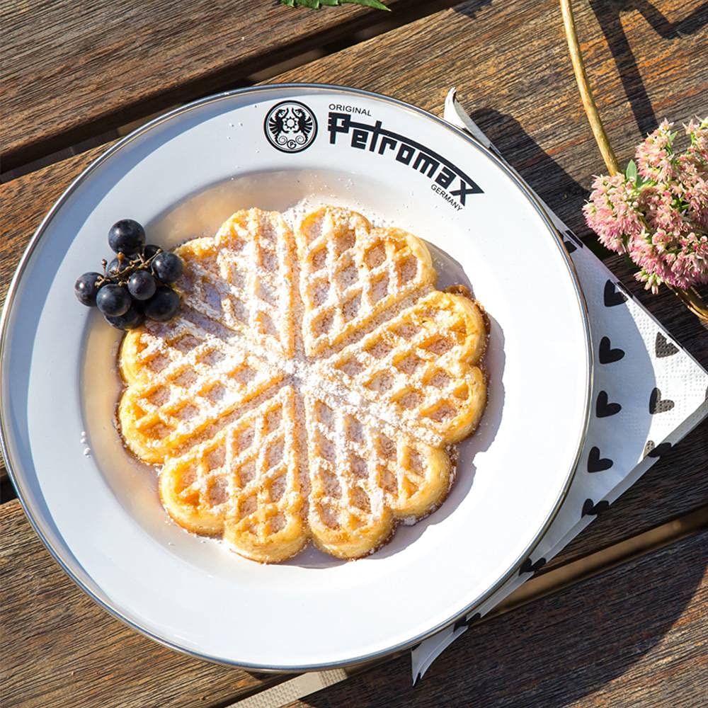 Petromax plate with stainless steel rim detail emphasizing durability.