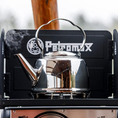 Petromax teakettle on induction stove delivering even heat distribution