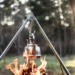 Petromax teakettle with movable handle for hanging over a campfire
