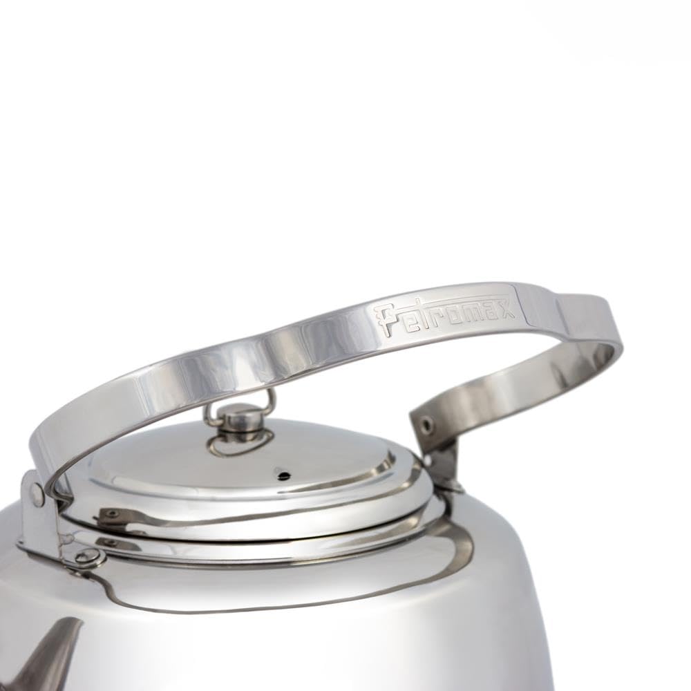 Petromax teakettle with movable threefold handle for hanging over fire.