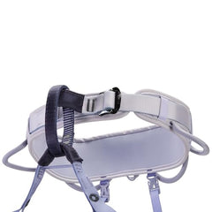PETZL Corax LT women's harness shoulder strap detail highlights secure adjustability for climbs.