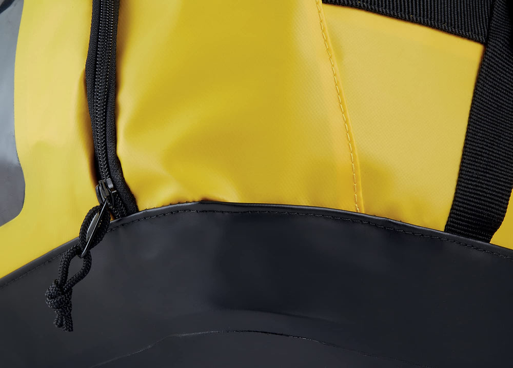 Petzl Duffel 65 side pocket stores helmet or shoes for separate storage.