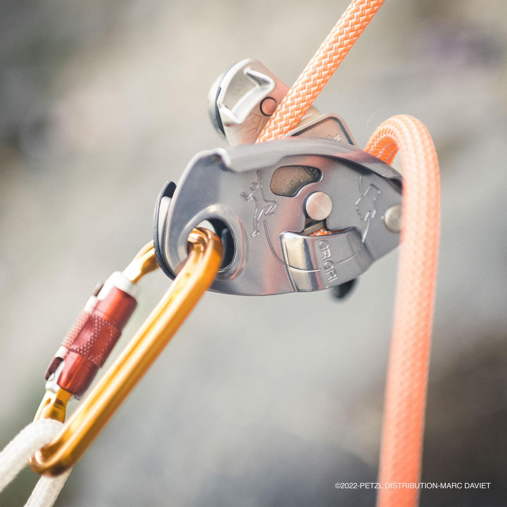 PETZL Grigri gray outdoor climb scenario showing versatile rope handling.