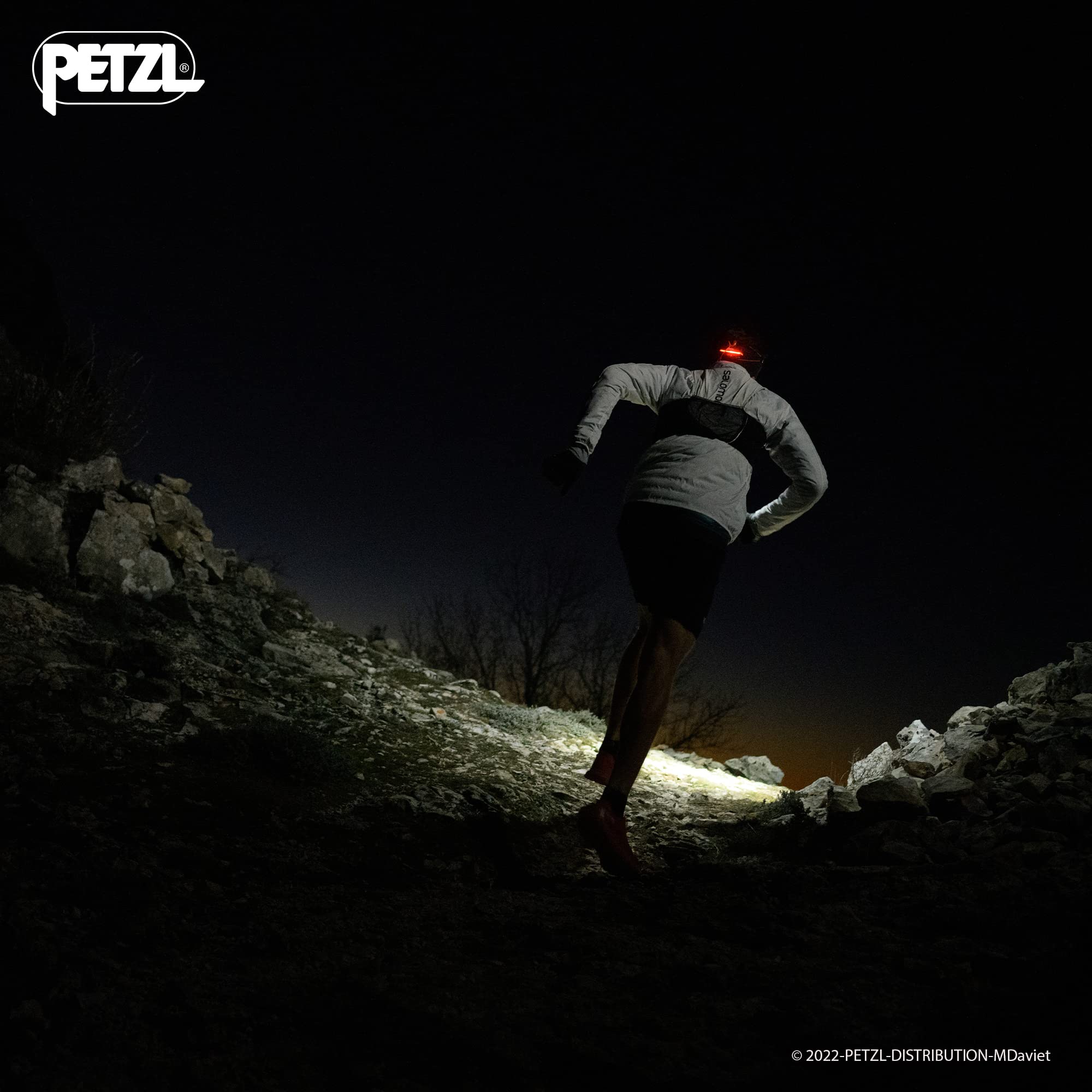 Petzl NAO RL headlamp rear red light visible behind the user