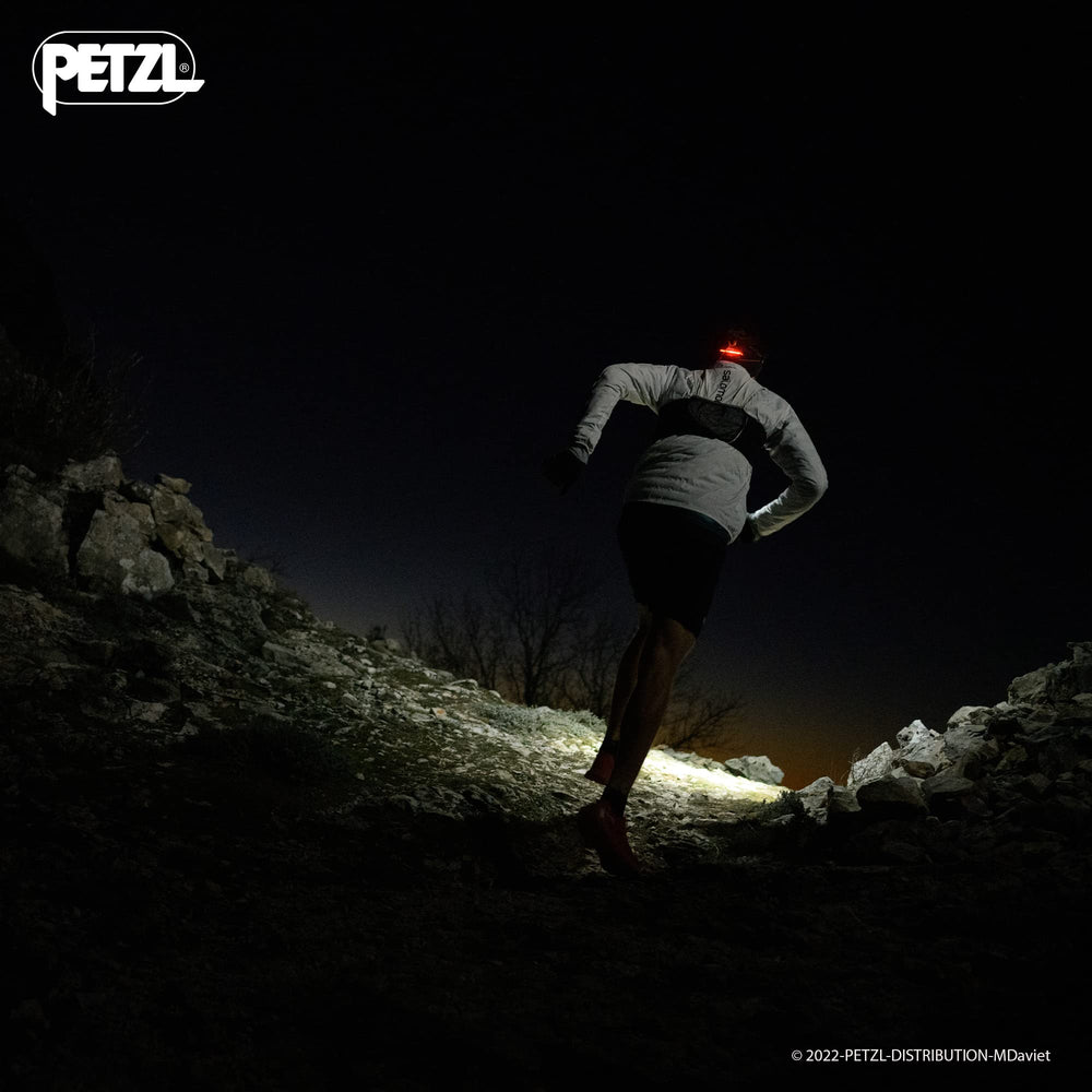 Petzl NAO RL headlamp rear red light visible behind the user
