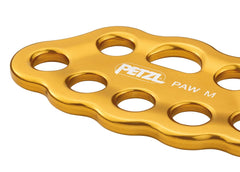 Petzl PAW yellow medium in use highlighting forged aluminum strength and light weight.