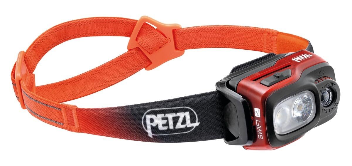 Petzl Swift RL headlamp front view in orange shows trail-ready illumination.