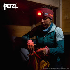 Petzl Swift RL headlamp side view demonstrating ergonomic design for nighttime wear.