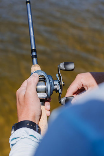 Pflueger President aluminum handle visible for confident grip during retrieves