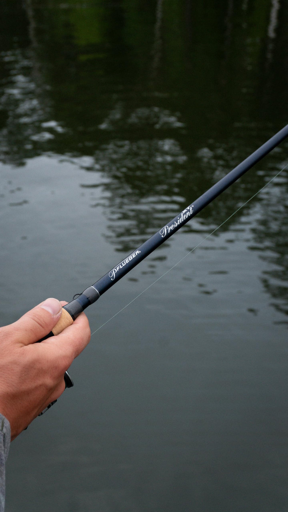 Pflueger President XT in-hand shot conveys balanced design for steady casting.