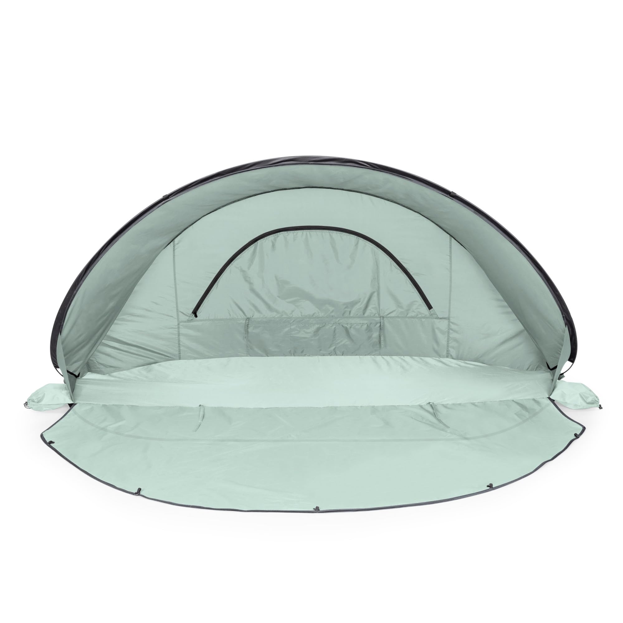 Manta sun shade with built-in floor privacy screen on the beach.