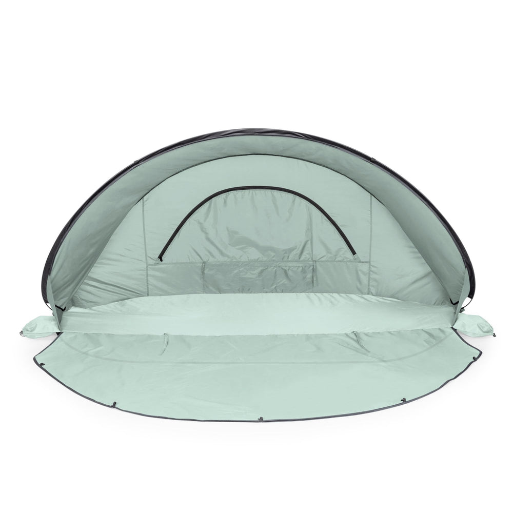 Manta sun shade with built-in floor privacy screen on the beach.