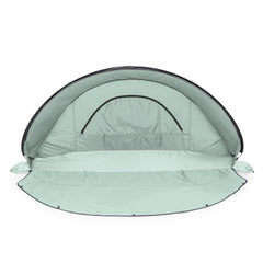 Manta sun shade with built-in floor privacy screen on the beach.