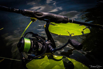 Feather-light Carbon X spinning reel in use on freshwater setup