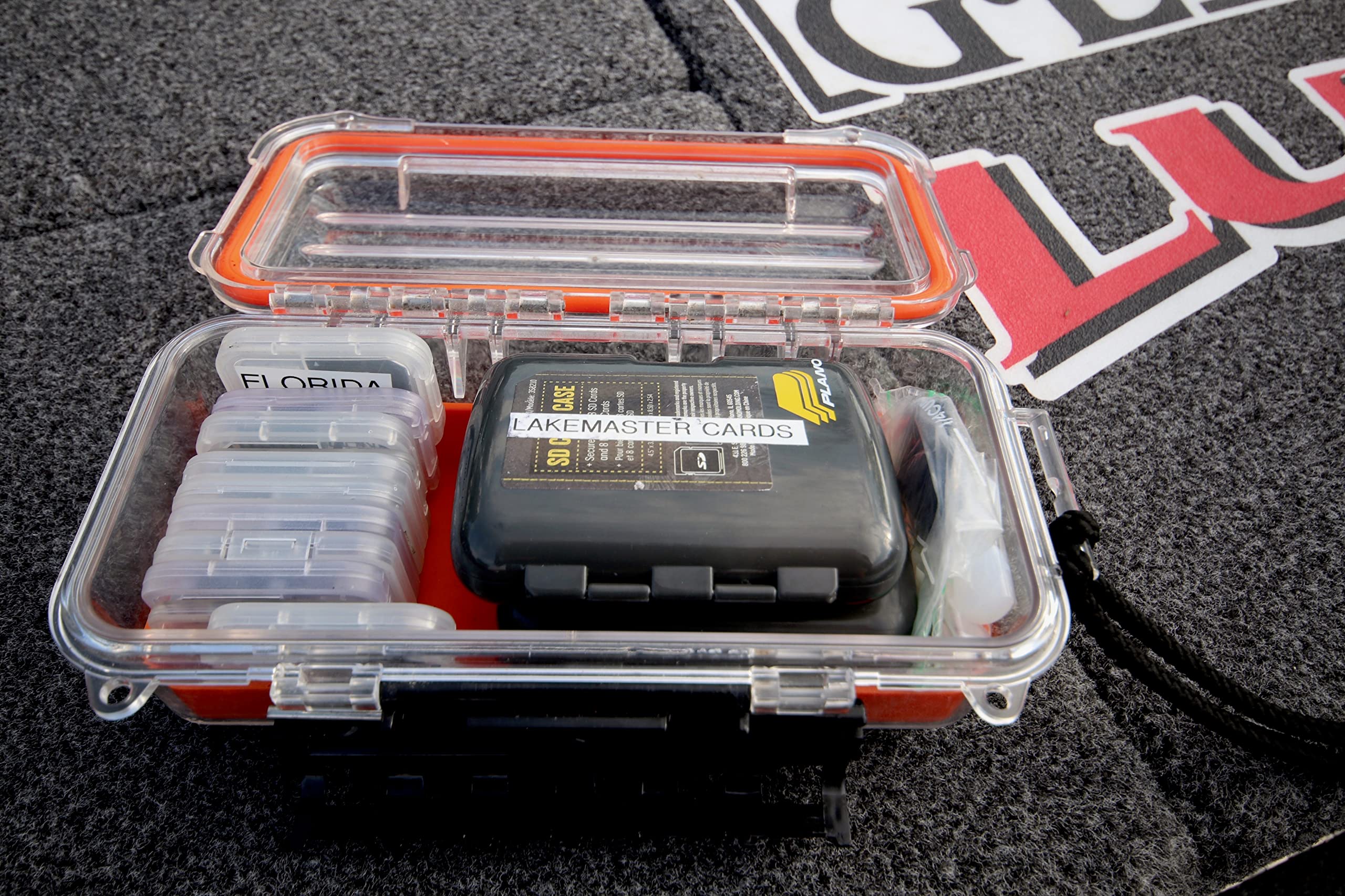 Plano Guide Series 3500 field box orange open interior reveals slip-resistant padding.
