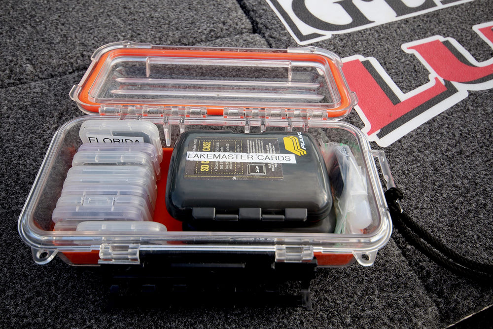 Plano Guide Series 3500 field box orange open interior reveals slip-resistant padding.