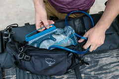 Platypus Big Zip EVO drink-tube disconnect enables fast, easy tube access in the field.