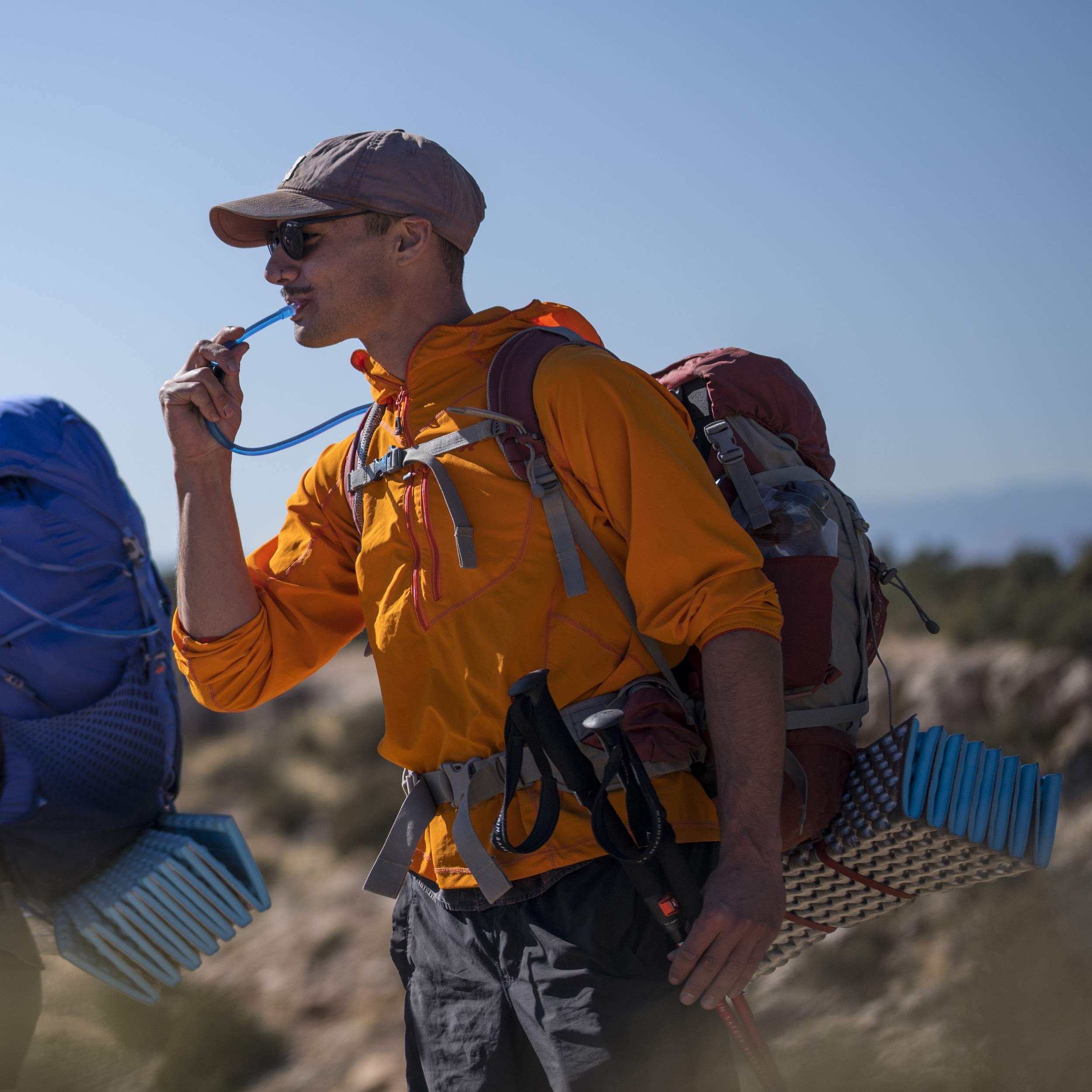 Platypus Hoser hanging loop securing hydration in pack during climbs.