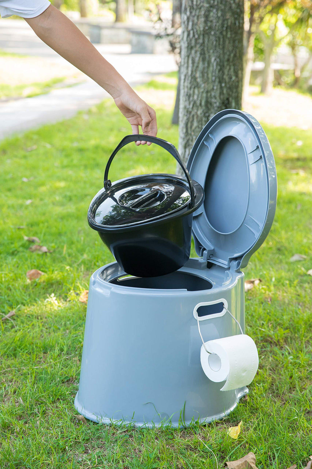 Playberg portable toilet shown with 8-gallon waste bags for simple cleanup.