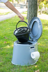 Playberg portable toilet shown with 8-gallon waste bags for simple cleanup.