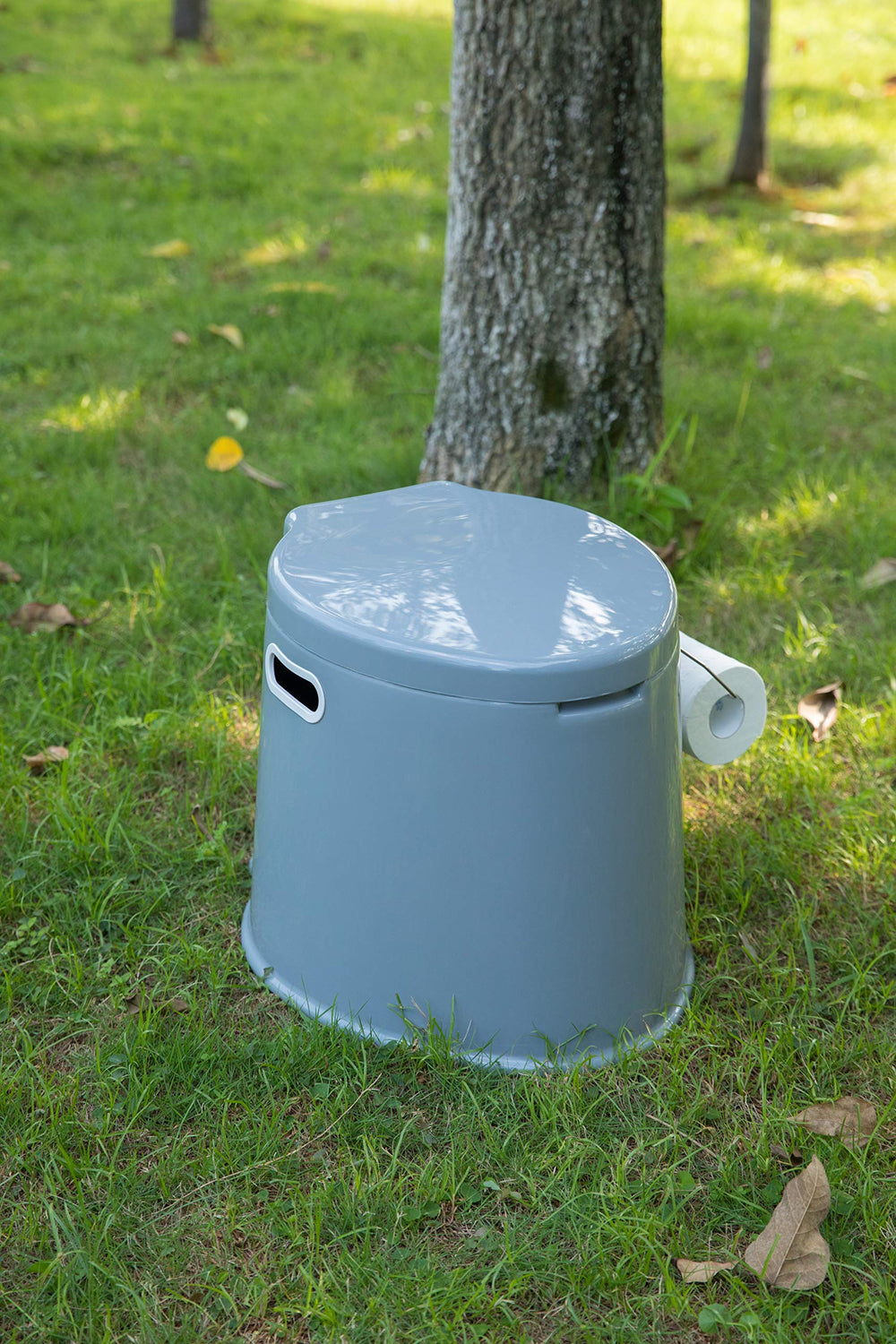 Playberg portable toilet features integrated paper holder for quick access.
