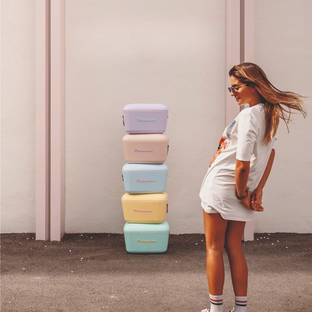 Polarbox lilac retro cooler full of cans showcases 20L capacity.