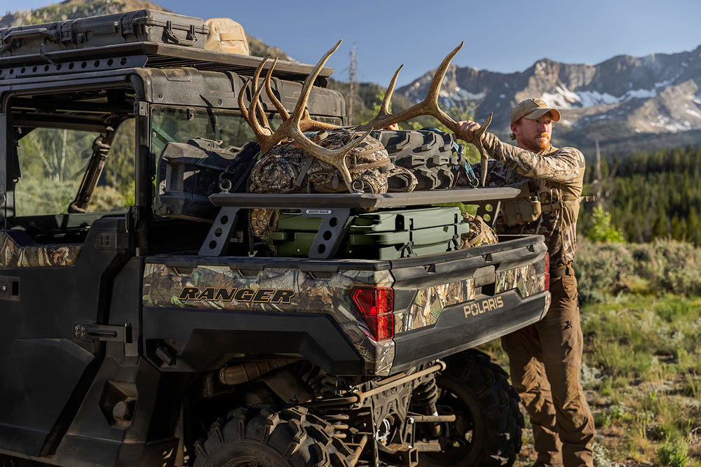 Polaris NorthStar 30 Qt cooler on rugged terrain ready for camping adventures