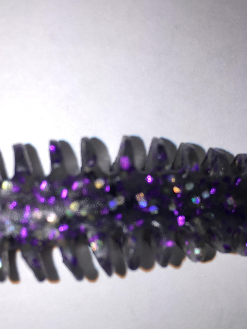 Poor Boy's Baits Smoke Purple Erie Darter Grey in water action, demonstrating lifelike movement.