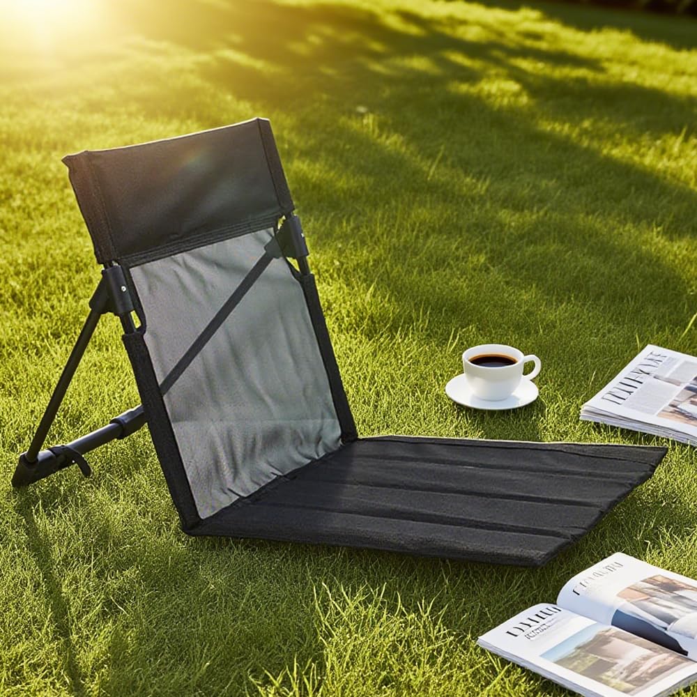 Portable camping chair set up during a picnic or lawn gathering for comfortable seating.