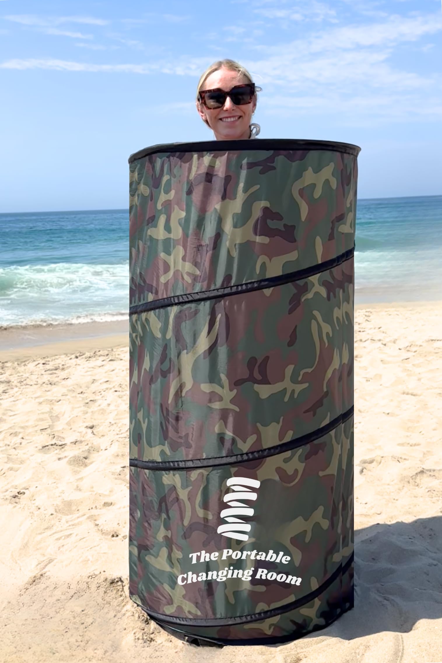 The Portable Changing Room privacy tent at the beach enables easy changes.