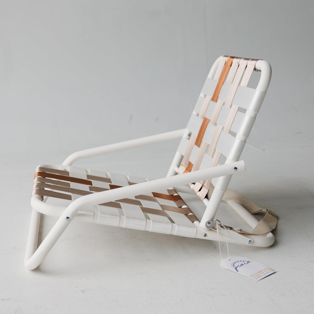 Praia Beach Chair low-profile silhouette fits into any setting.