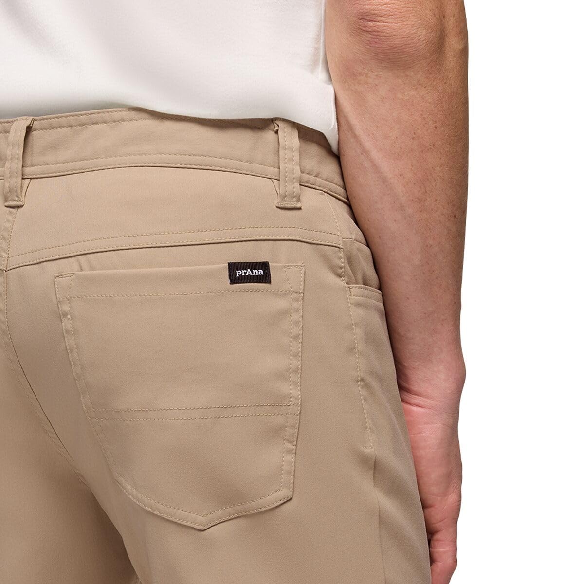 PrAna Stretch Zion SL pants Sandbar waist closure detail featuring metal shank closure.