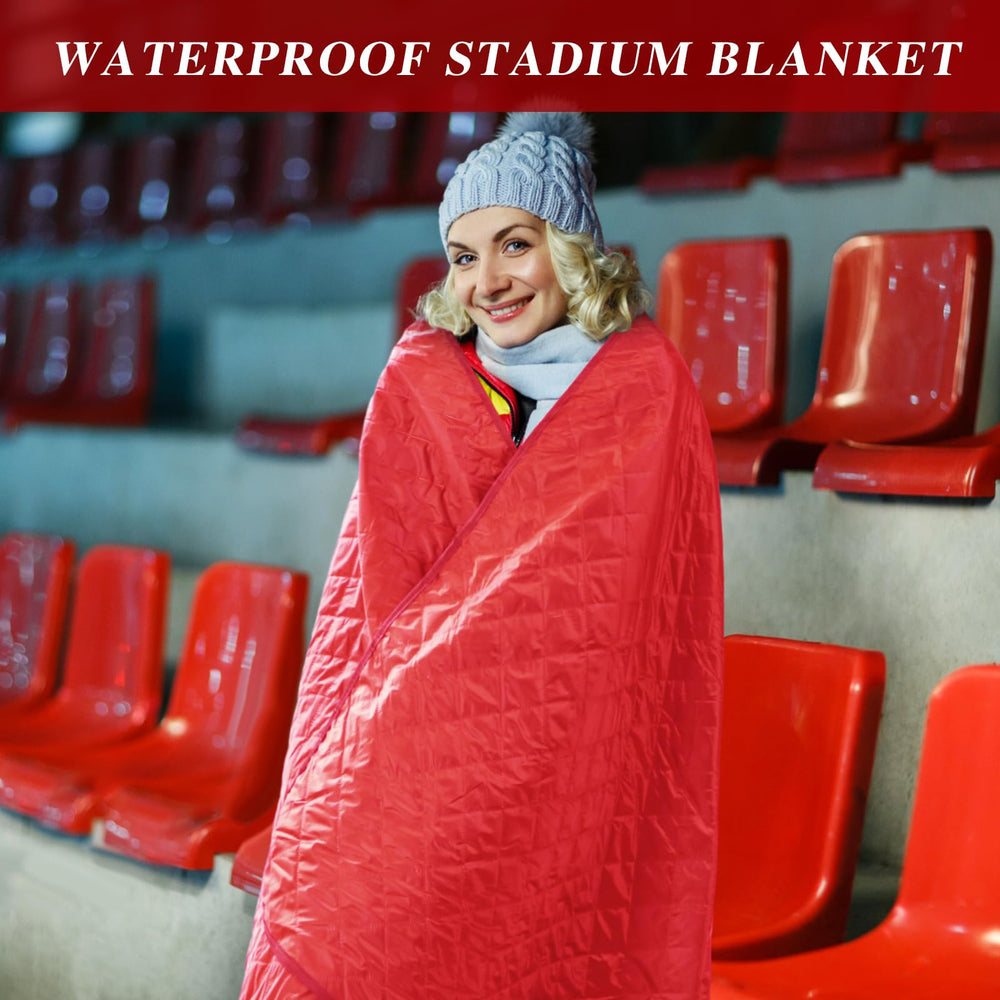 Preboun stadium blanket red at a concert illustrates warmth in chilly crowds