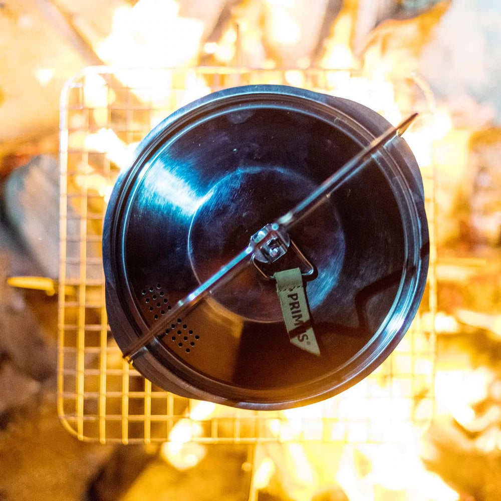 Primus Campfire Pot 3L with metal lid for safe, on-fire cooking.