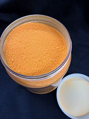 Eggs curing in container with borax coating visible for consistent results.