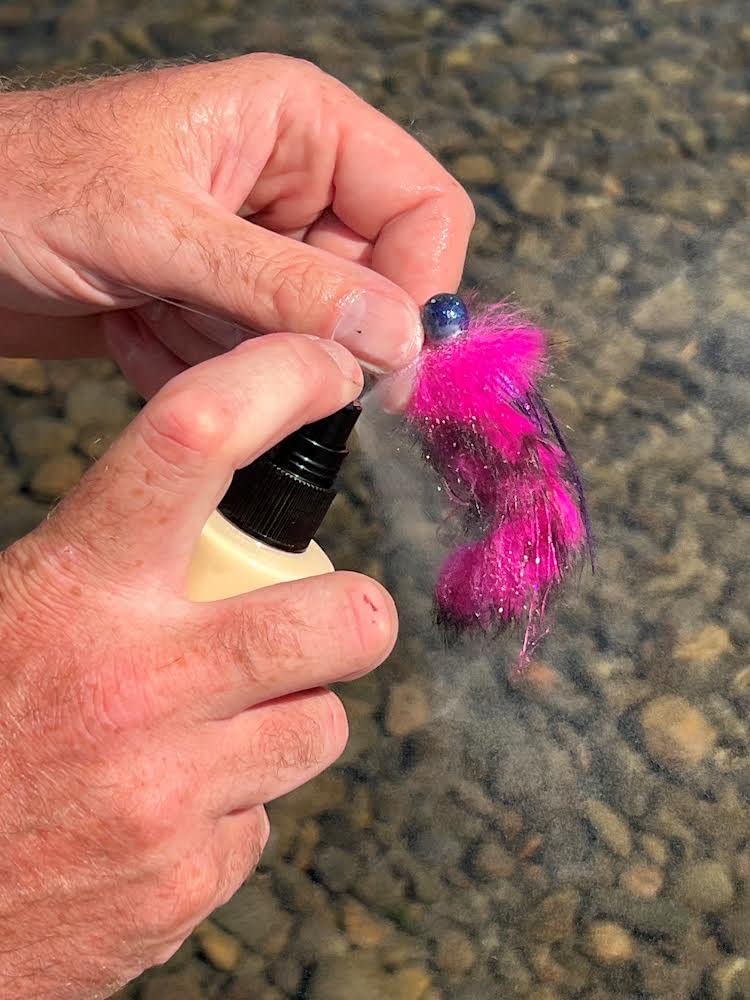 Pro-Cure Herring Water-Soluble pour action showing easy bait application.