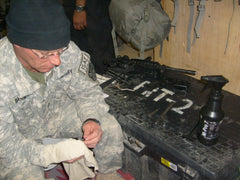 Prom Pro7 gun cleaner bottle showing multi-use formula