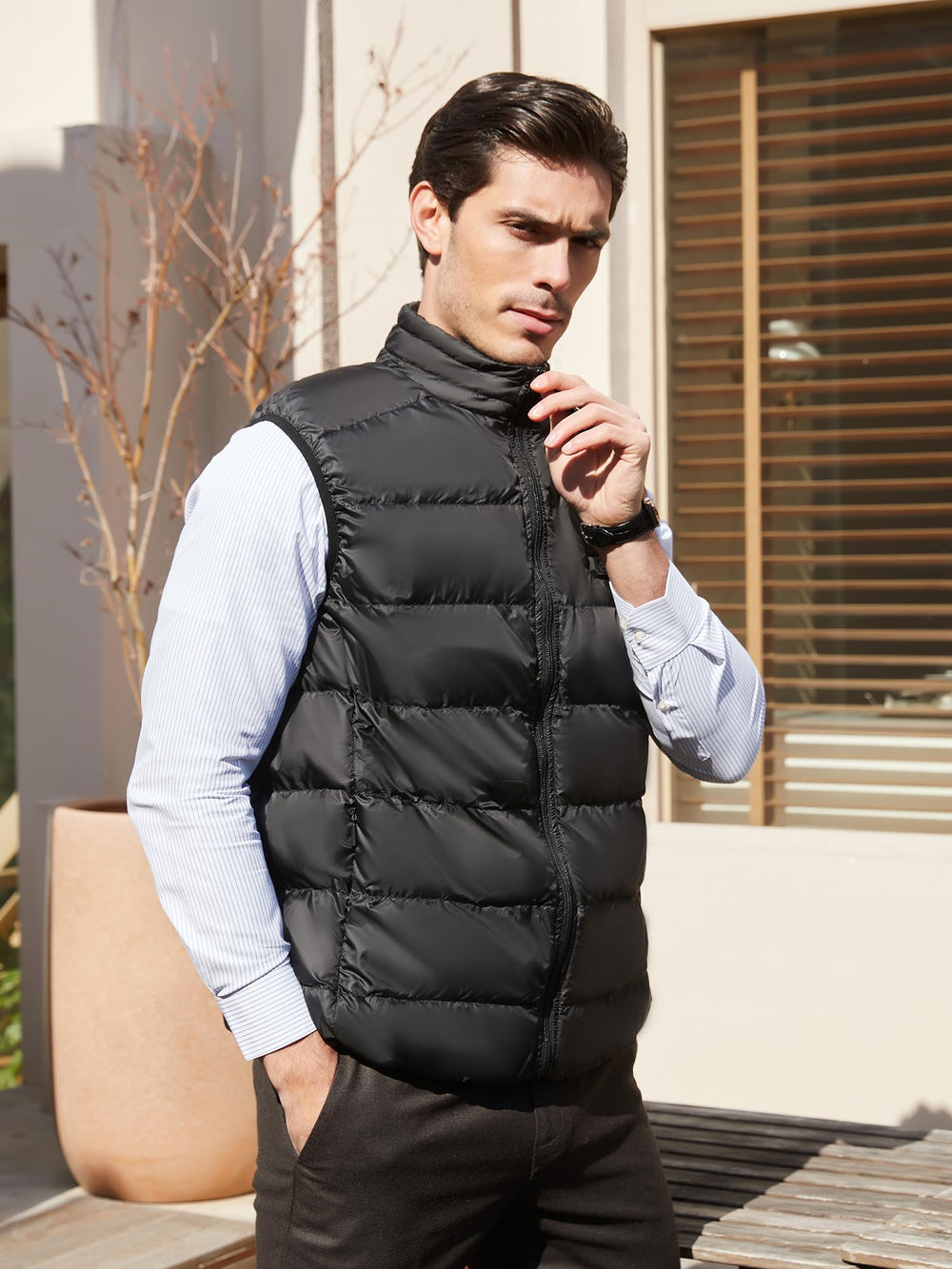 PTAHDUS vest being worn during skiing or camping highlights versatility.