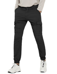 PULI men's hiking pants water-resistant fabric for light rain hikes and wet grass paths.