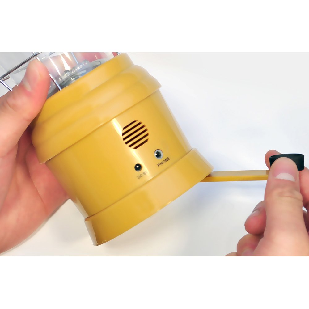Crank-powered dynamo in action powering the internal battery for on-the-go use