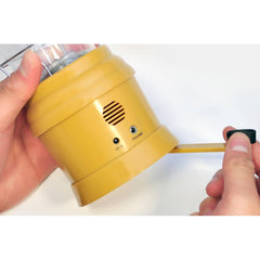 Crank-powered dynamo in action powering the internal battery for on-the-go use