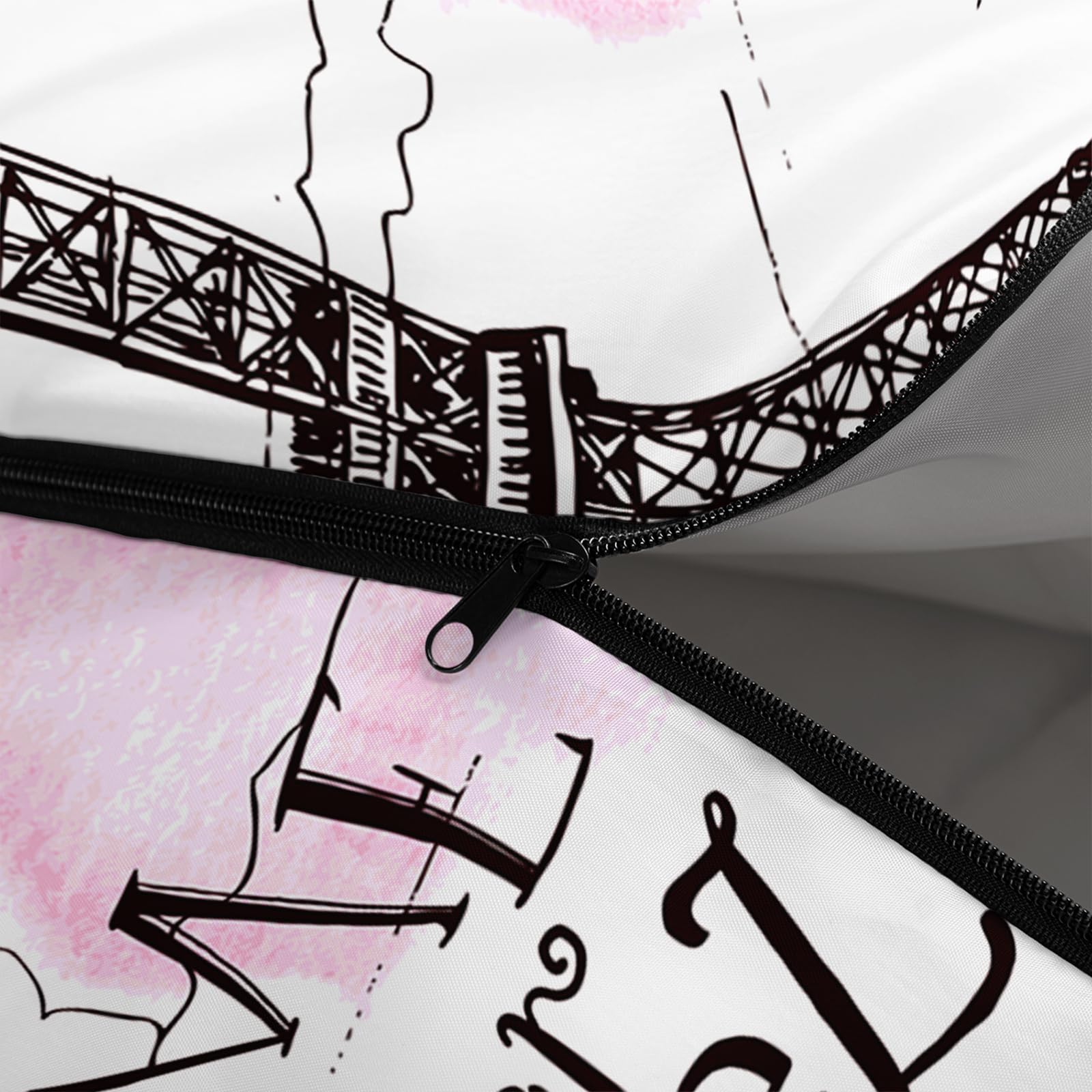QOOMO pink Eiffel Tower sleeping bag hood drawstring secures warmth.