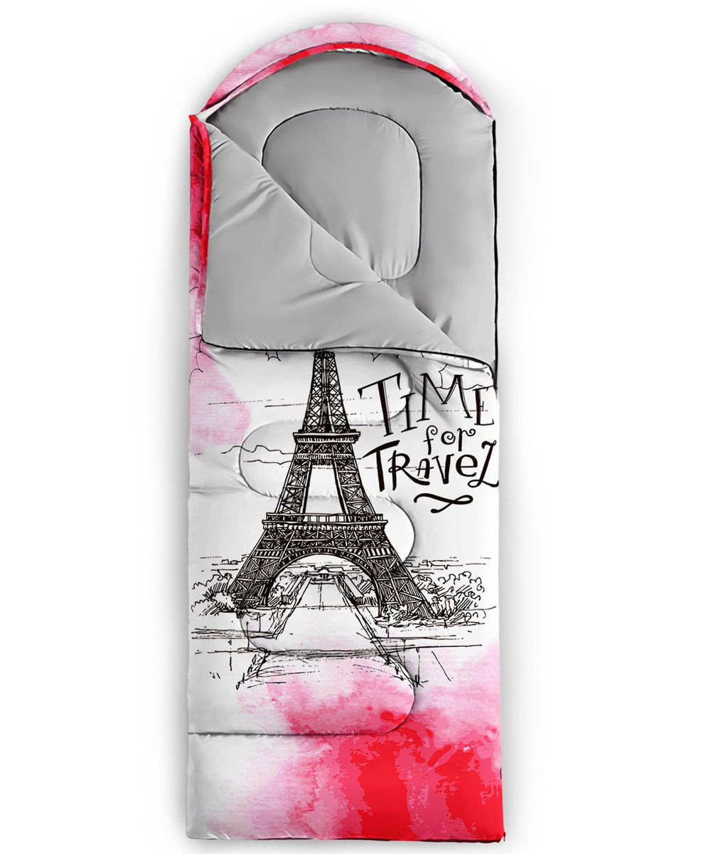 QOOMO pink Eiffel Tower sleeping bag packed in cylinder, travel-ready.