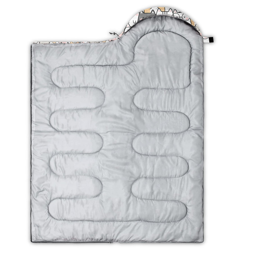 QOOMO Sleeping bag used in camping scenarios like campsite or car emergency.