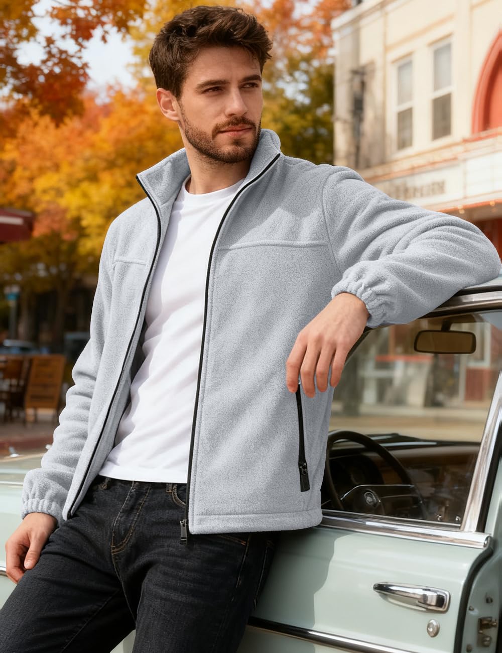 QOSOQ fleece jacket with pockets provides secure storage during outdoor activities.
