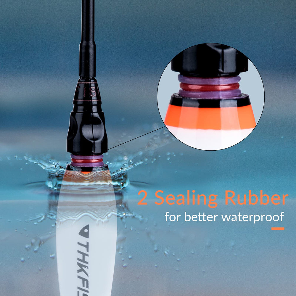 LED fishing bobbers glowing at night on water